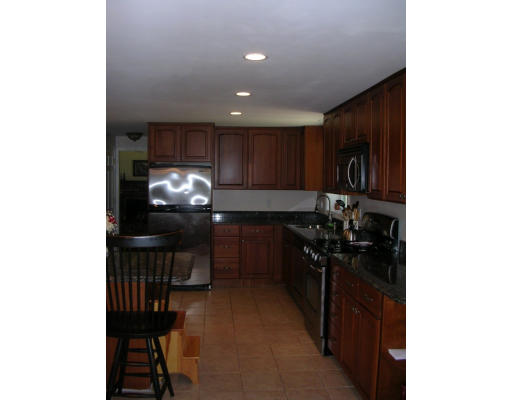55 Box Mill Road Boxborough, MA 01719 - Photo 12 of 16 a kitchen with a sink and cabinets