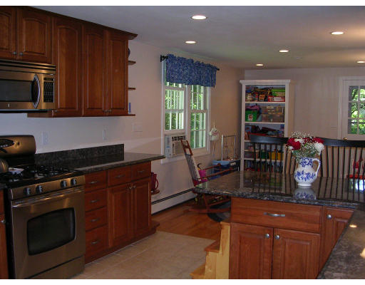 55 Box Mill Road Boxborough, MA 01719 - Photo 13 of 16 a kitchen with stainless steel appliances granite countertop a stove a sink dishwasher and cabinets with wooden floor