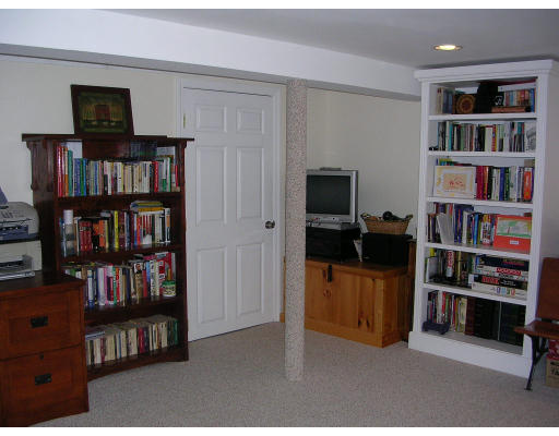 55 Box Mill Road Boxborough, MA 01719 - Photo 14 of 16 a view of a workspace with bookshelf