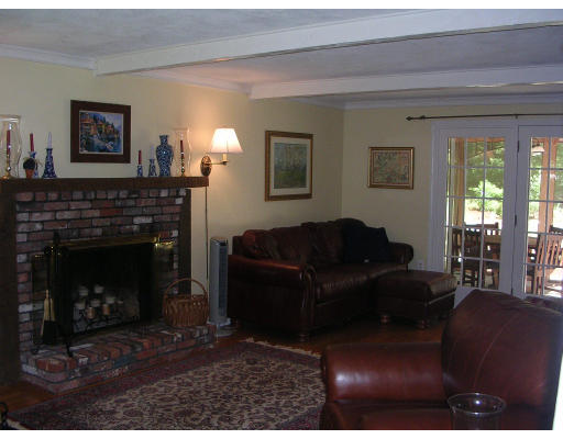 55 Box Mill Road Boxborough, MA 01719 - Photo 5 of 16 a living room with furniture and a fireplace