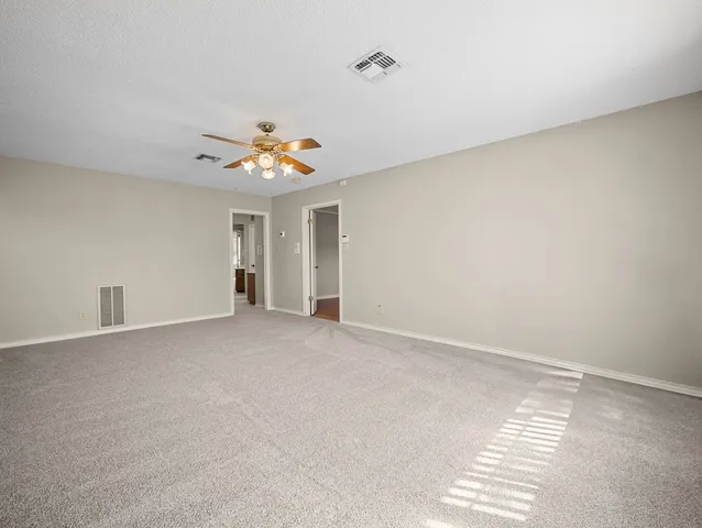a bathroom with a tub a sink and a window