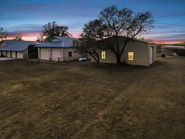 a view of a house with a back yard