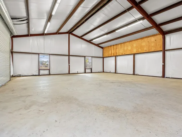 a backyard of a house with a yard and mountain view in back
