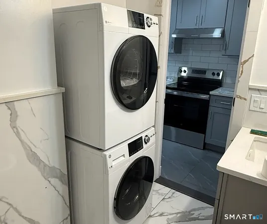 a utility room with dryer and washer