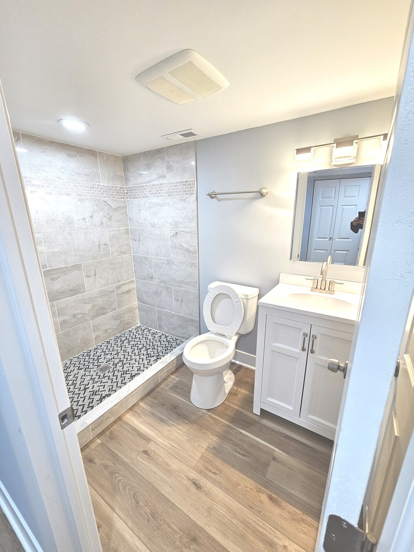 14926 Kenton Avenue Midlothian, IL 60445 - Photo 19 of 20 a bathroom with a sink toilet and shower