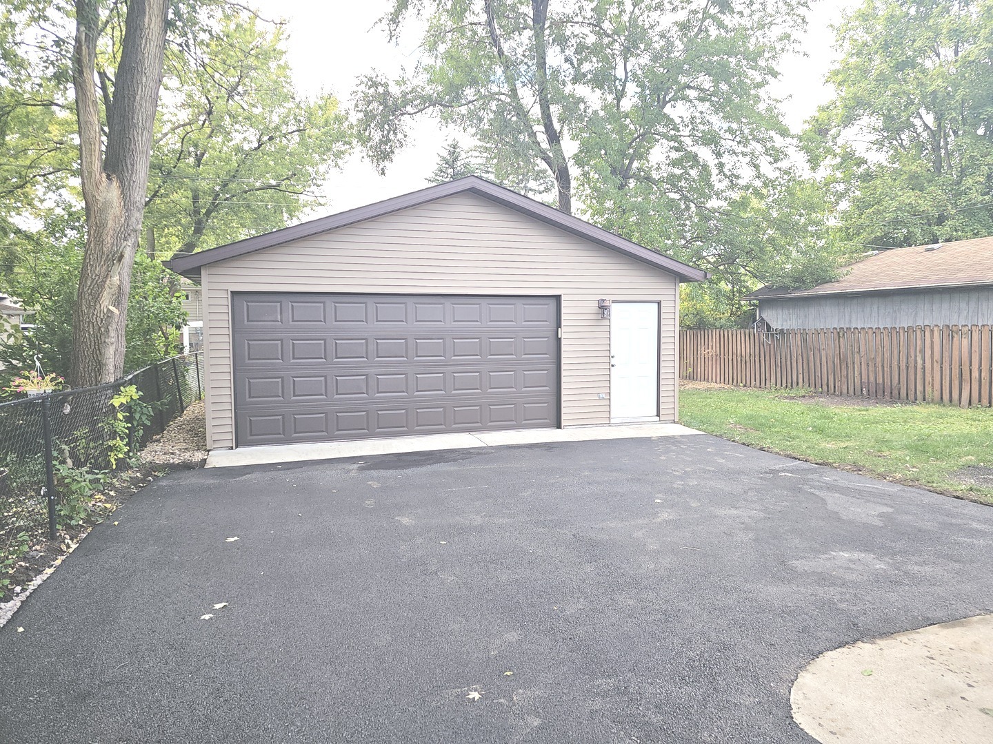 14926 Kenton Avenue Midlothian, IL 60445 - Photo 2 of 20 a view of backyard of house with garage