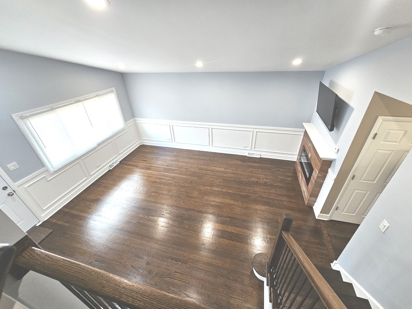 14926 Kenton Avenue Midlothian, IL 60445 - Photo 6 of 20 a view of an empty room with wooden floor and a window