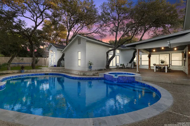 a view of a house with swimming pool
