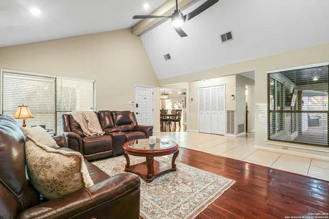 a living room with furniture and a rug
