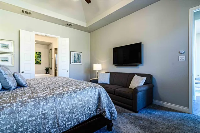 a living room with a couch and a flat screen tv