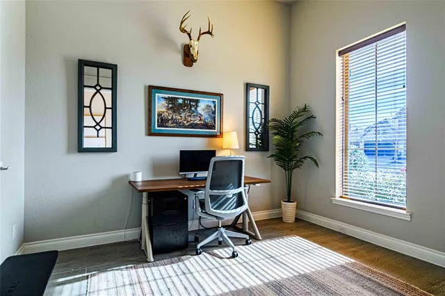 a workspace with furniture and a window