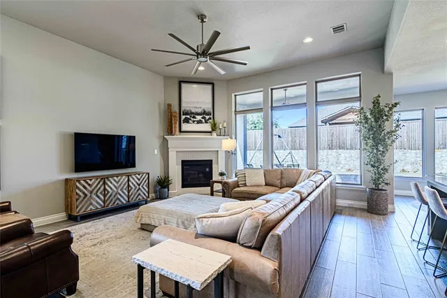 a living room with furniture fireplace and a flat screen tv