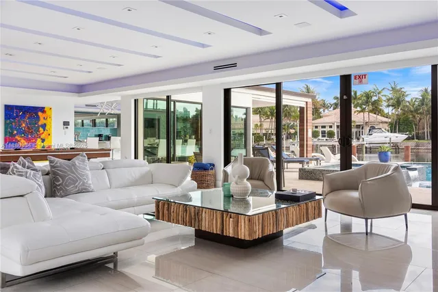 a view of a dining room with furniture large windows and wooden floor