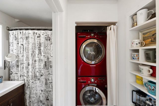 a view of a patio with table and chairs and potted plants