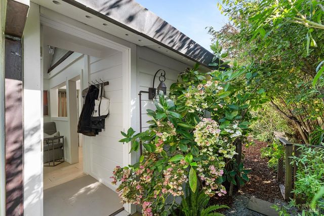 a wooden bench sitting in front of a building