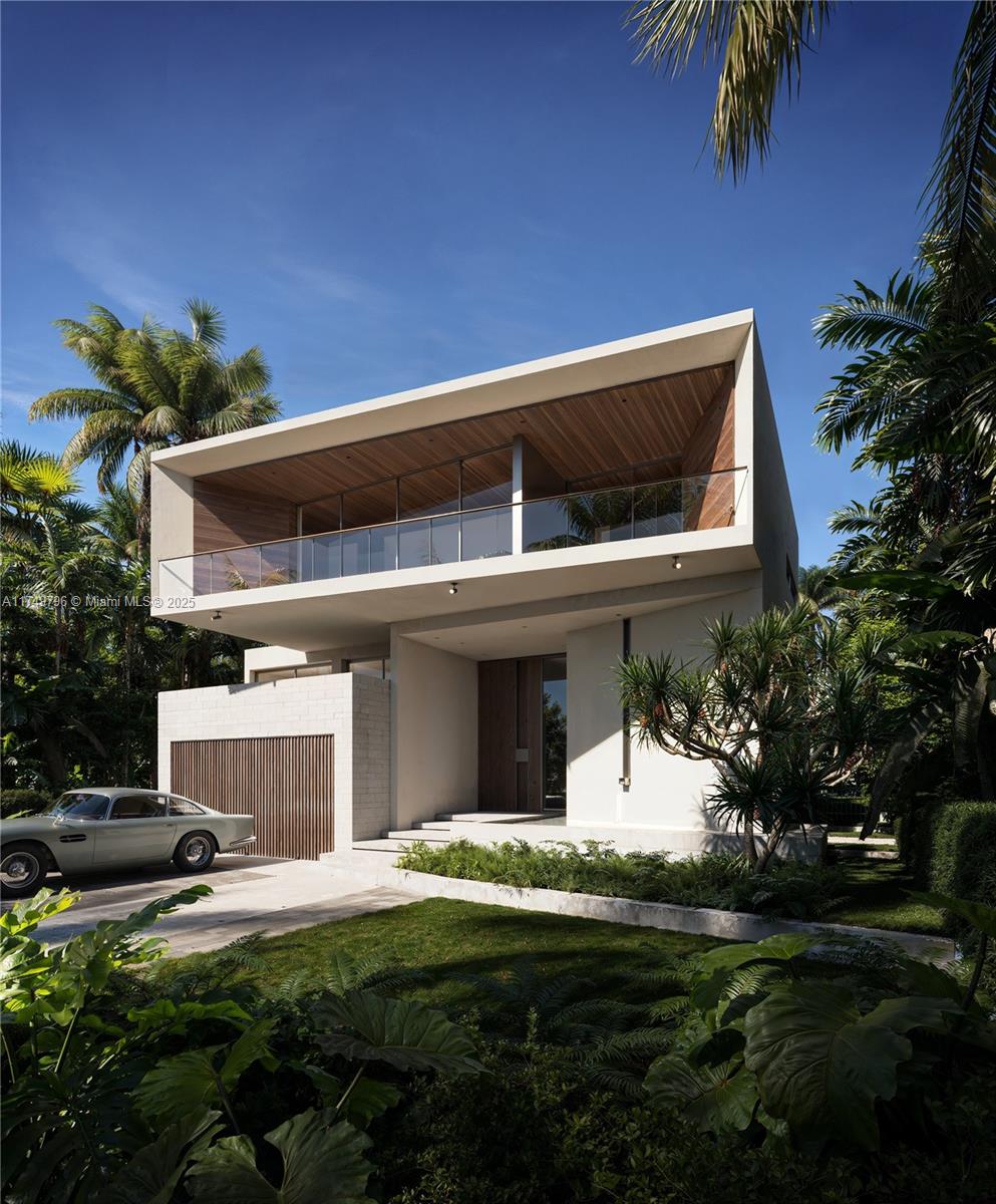 650 Ocean Blvd Golden Beach North Miami Beach, FL 33160 - Photo 8 of 18 a front view of a house with a garden