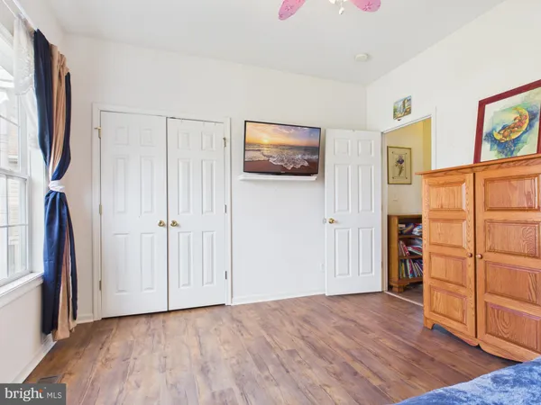 a bedroom with a bed and a chair