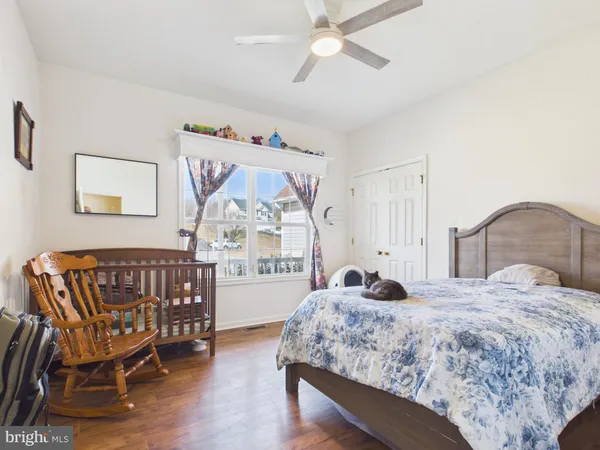a kitchen with granite countertop a sink and a white wooden cabinets
