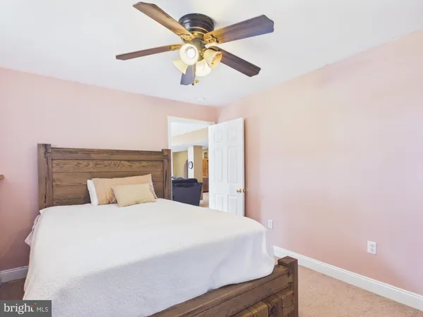 a bed room with a bed and a chair