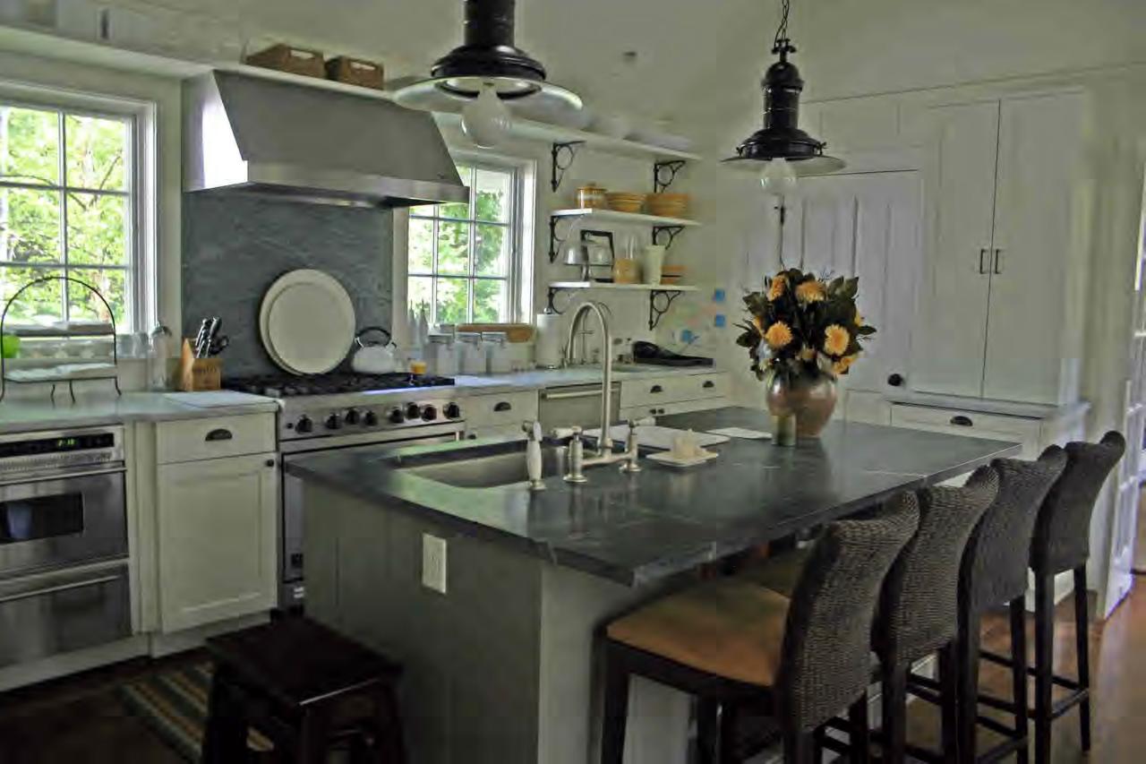 132 West Center Road West Stockbridge, MA 01266 - Photo 3 of 6 a kitchen with stainless steel appliances granite countertop a sink a stove and a wooden floors