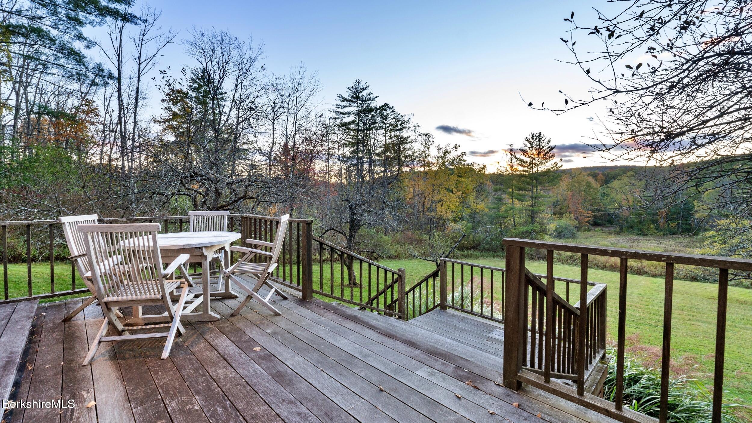 297 E Road Alford, MA 01266 - Photo 6 of 45 a view of a chairs and table on the wooden floor