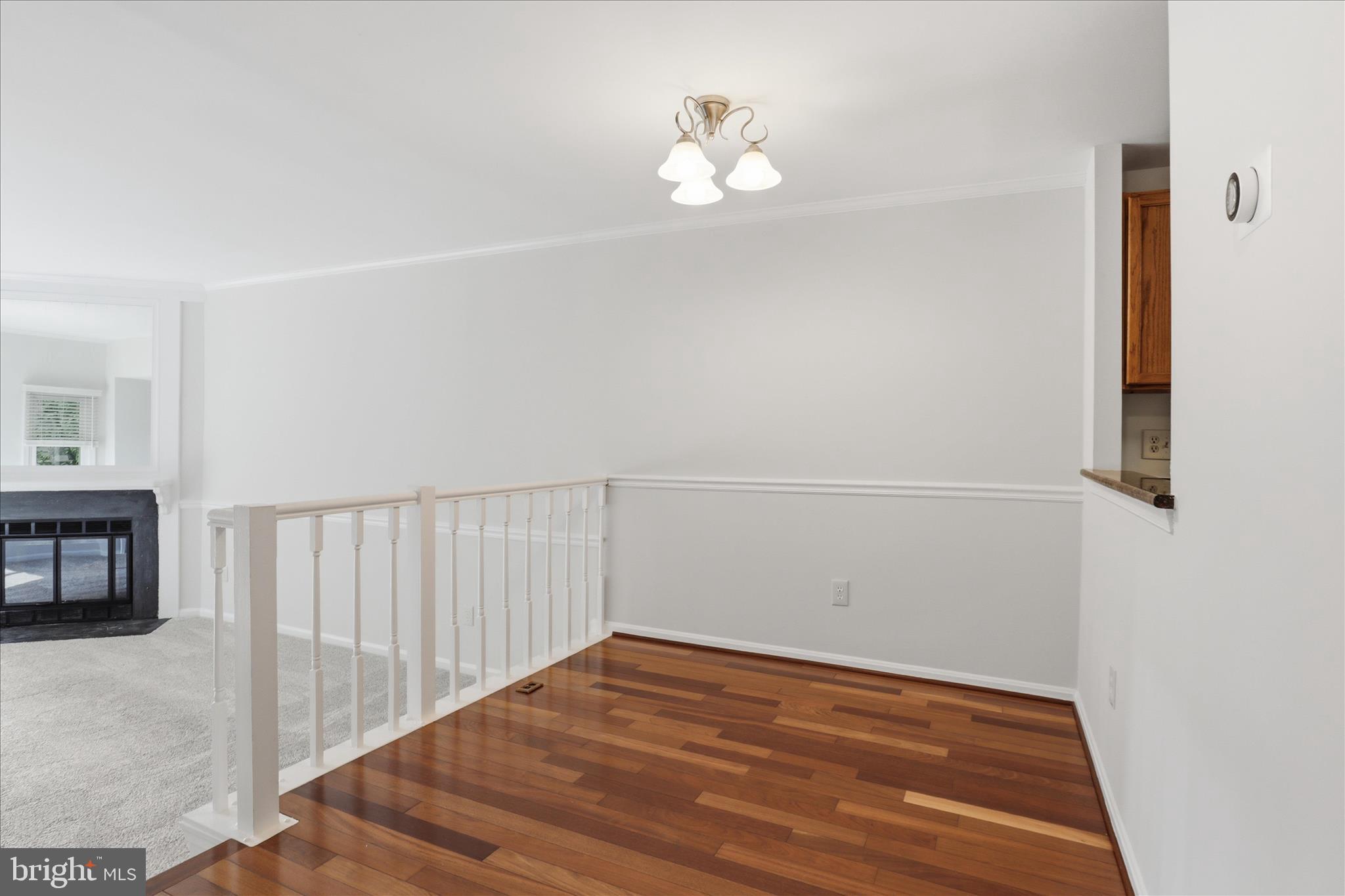 1773 Whisperhill Drive Reston, VA 20194 - Photo 14 of 51 a view of empty room with wooden floor