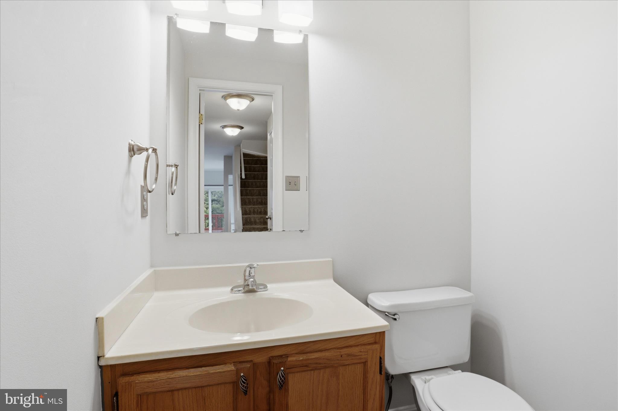1773 Whisperhill Drive Reston, VA 20194 - Photo 15 of 51 a bathroom with a sink a toilet and mirror