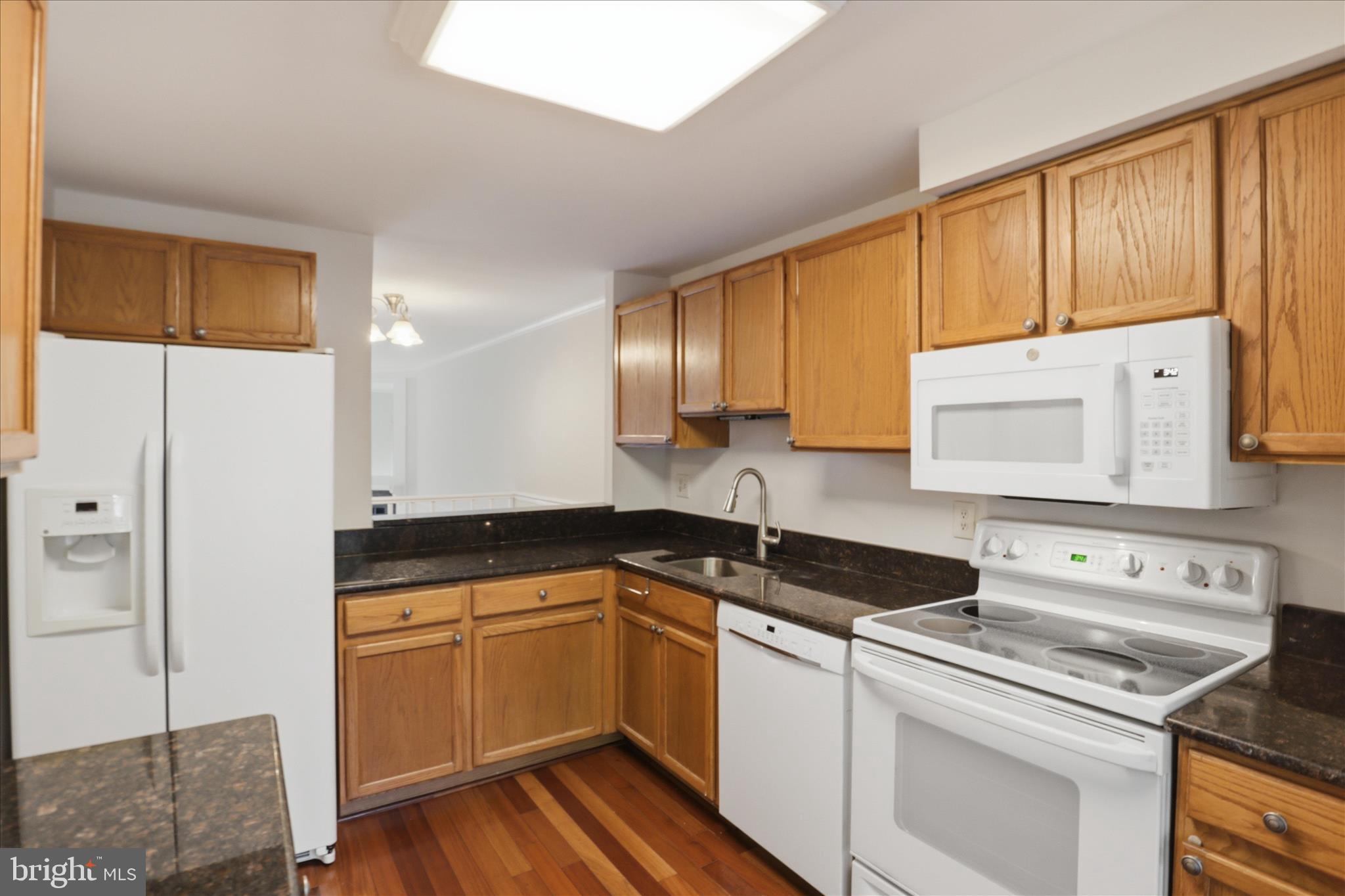 1773 Whisperhill Drive Reston, VA 20194 - Photo 19 of 51 a kitchen with a sink stove and cabinets