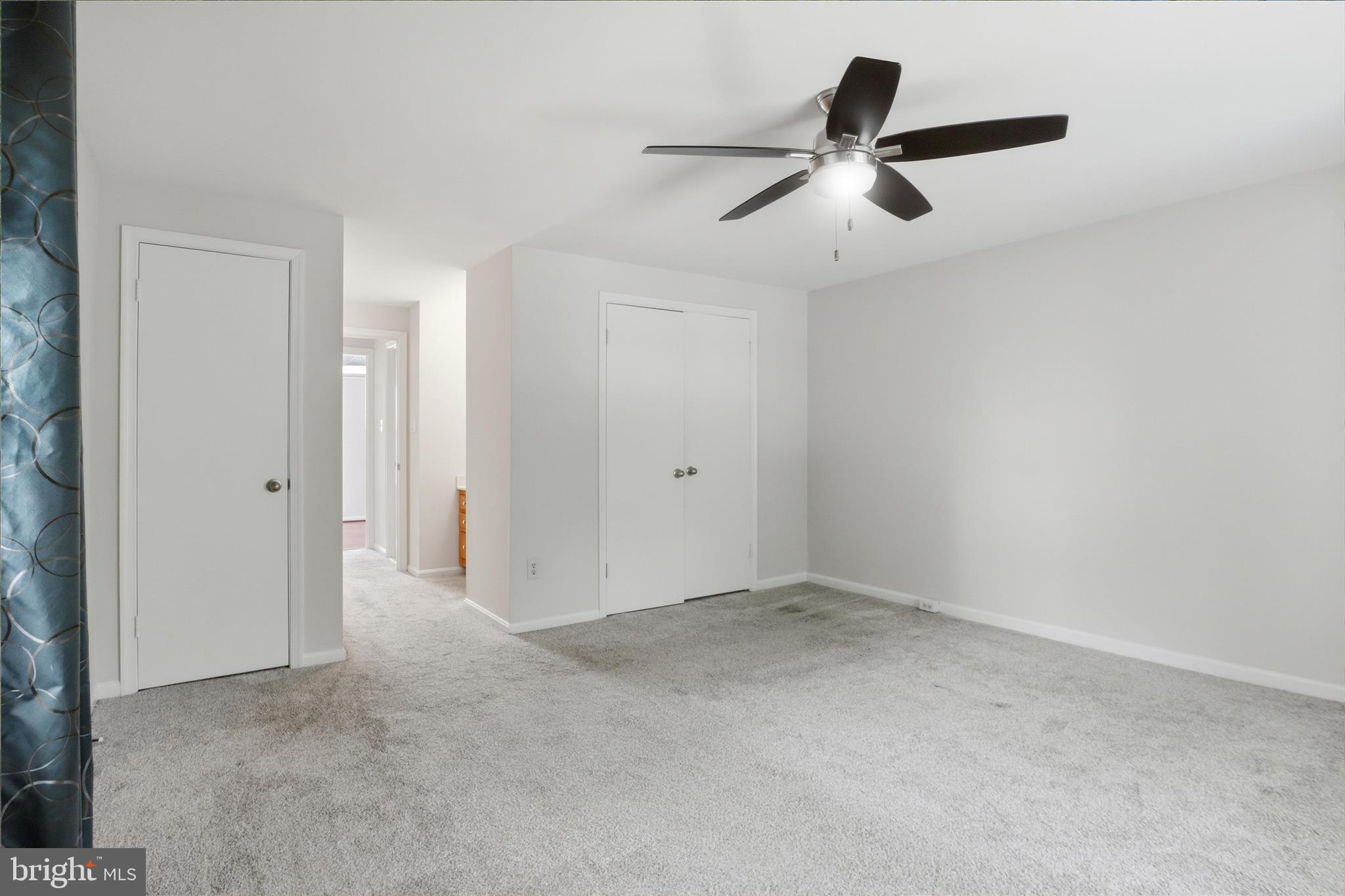 1773 Whisperhill Drive Reston, VA 20194 - Photo 24 of 51 an empty room with closet and ceiling fan