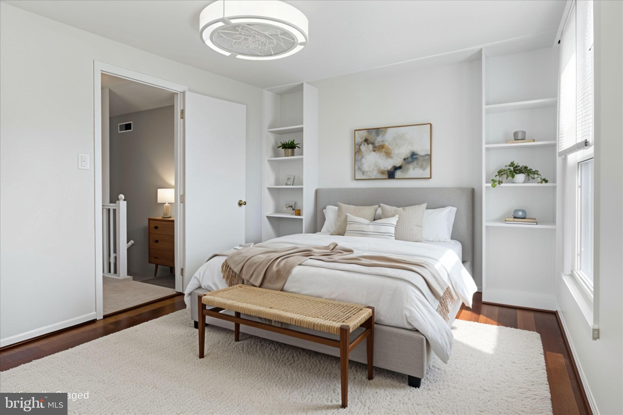 1773 Whisperhill Drive Reston, VA 20194 - Photo 26 of 51 a bedroom with a bed and painting on the wall