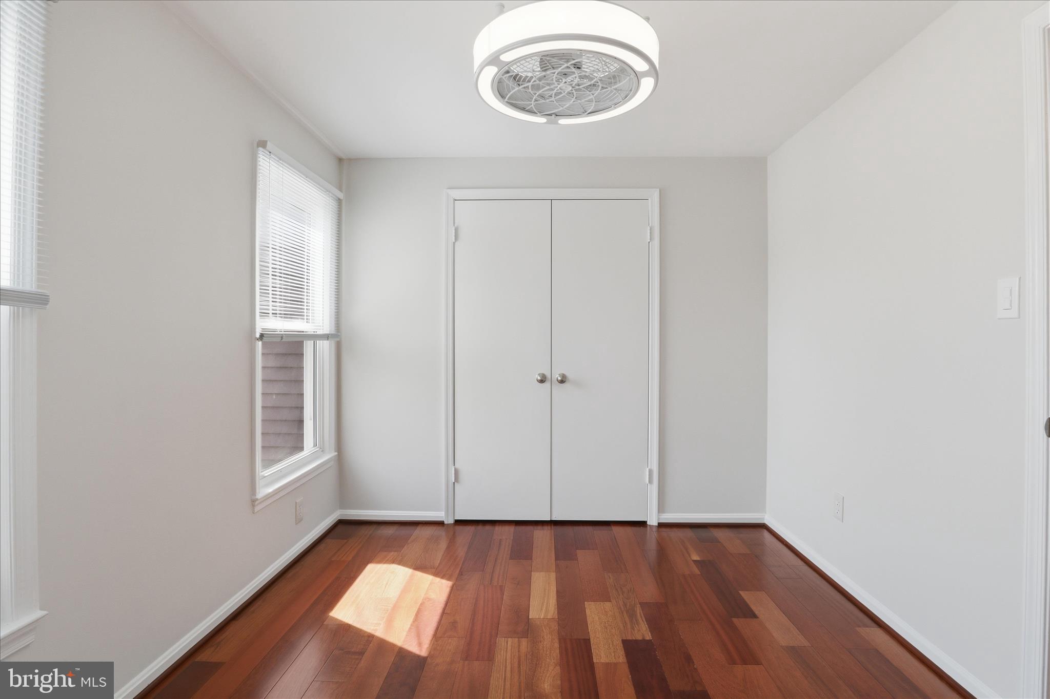 1773 Whisperhill Drive Reston, VA 20194 - Photo 28 of 51 a view of an empty room with wooden floor and a window