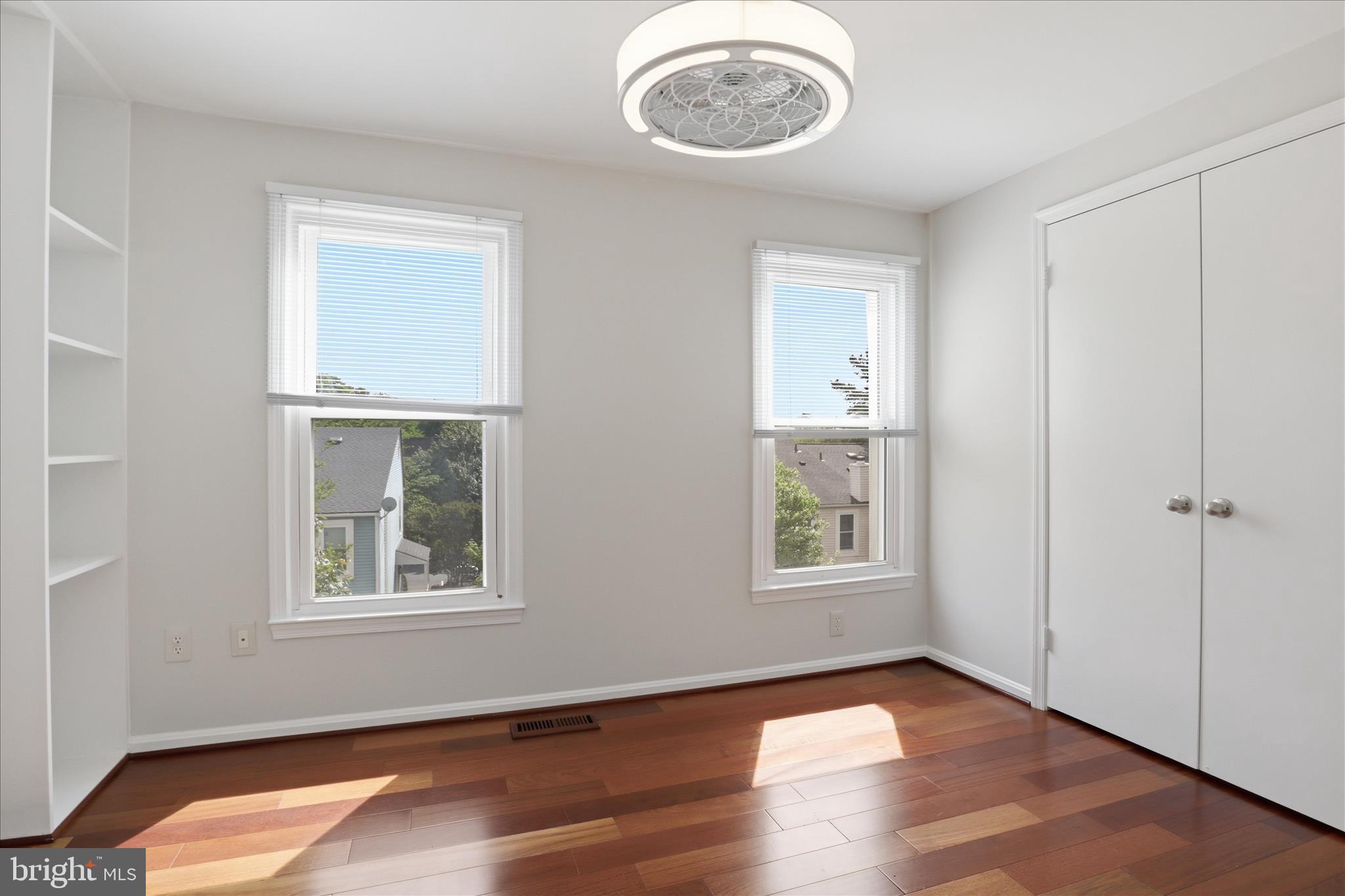 1773 Whisperhill Drive Reston, VA 20194 - Photo 29 of 51 an empty room with wooden floor and windows