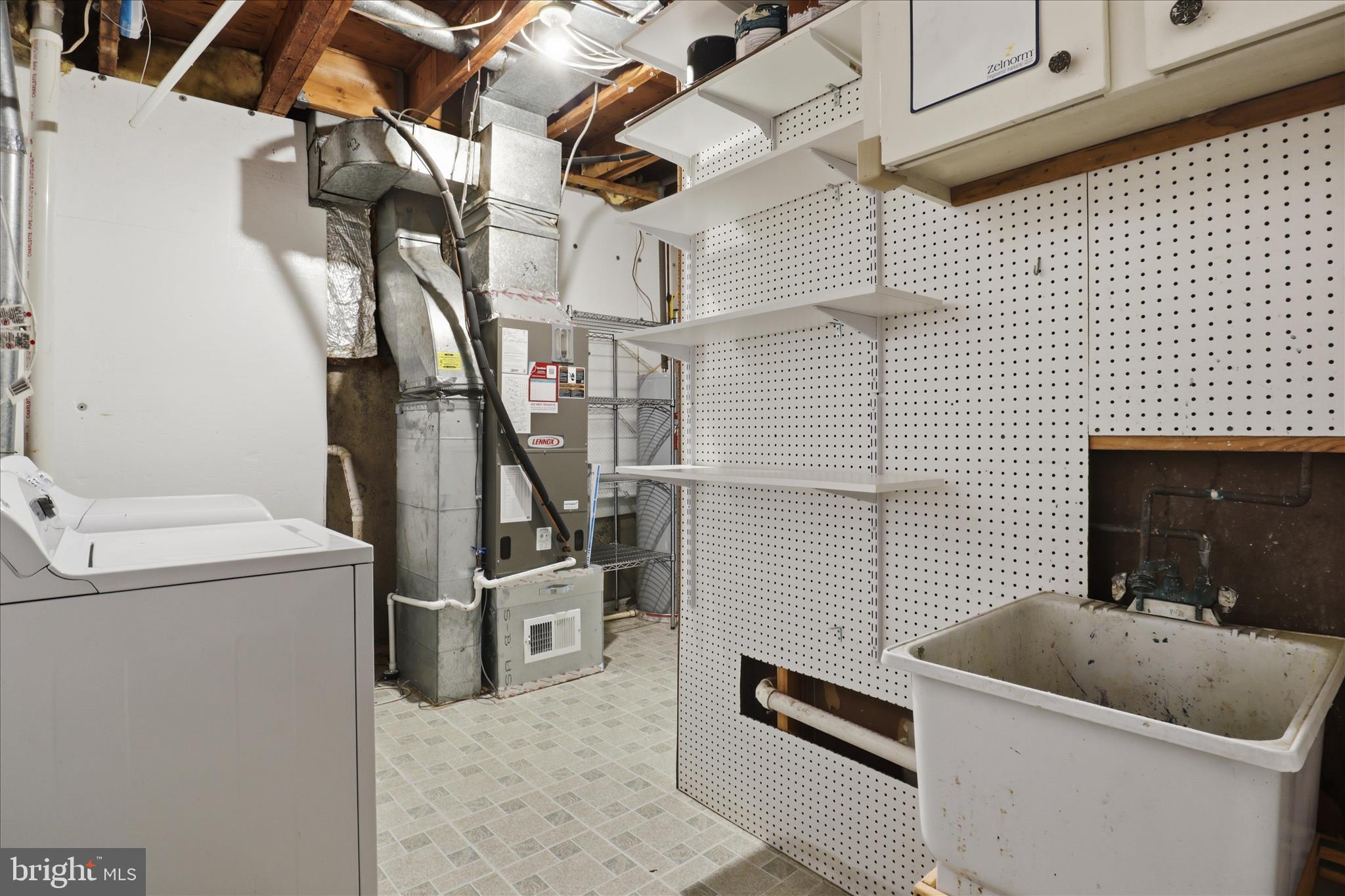 1773 Whisperhill Drive Reston, VA 20194 - Photo 38 of 51 a view of storage and utility room with washer and dryer