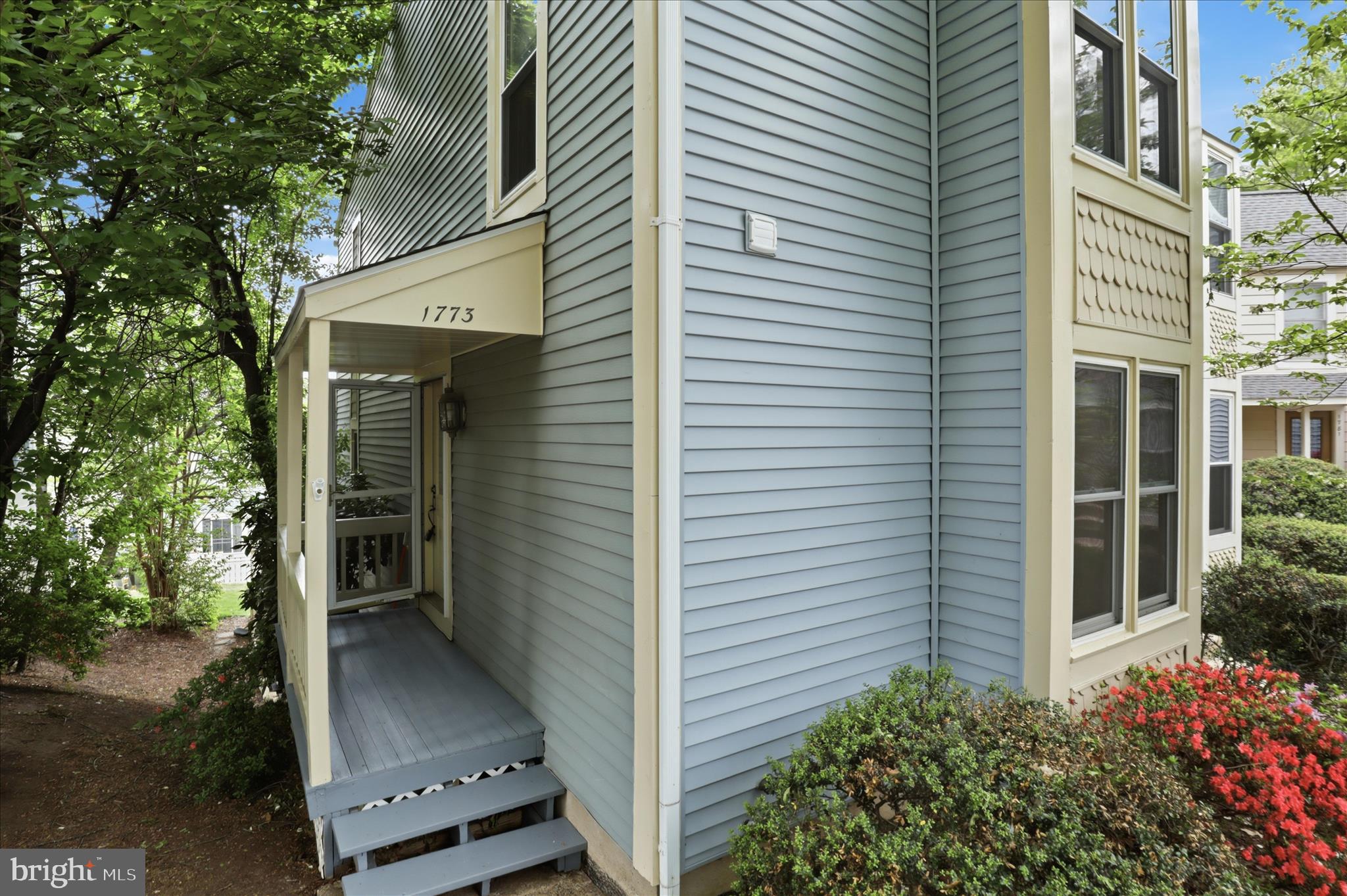 1773 Whisperhill Drive Reston, VA 20194 - Photo 5 of 51 a view of a porch with plants and a tree