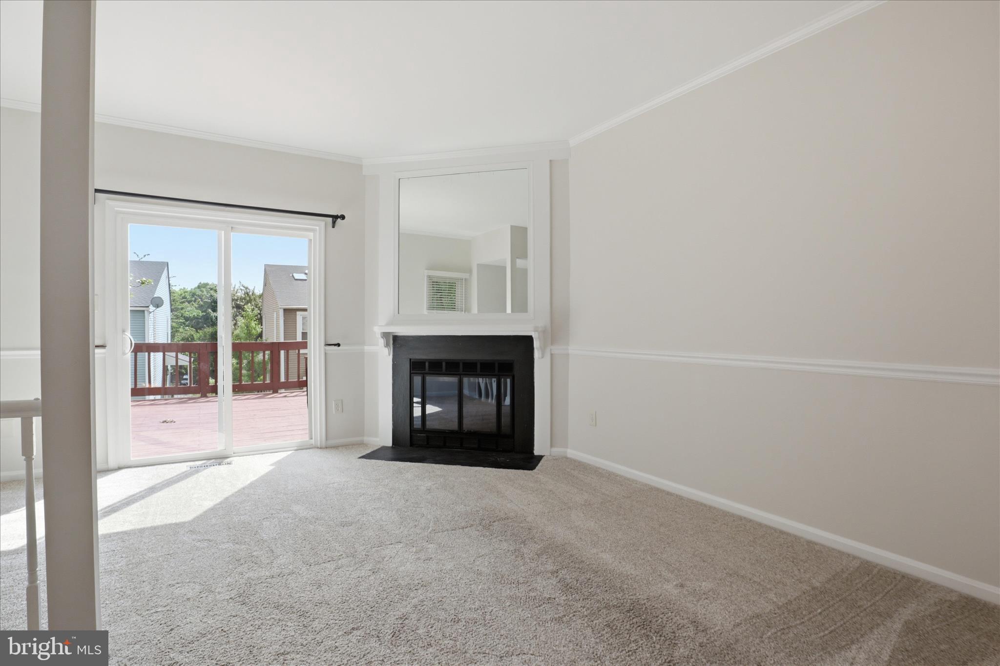 1773 Whisperhill Drive Reston, VA 20194 - Photo 10 of 51 an empty room with fireplace and a window
