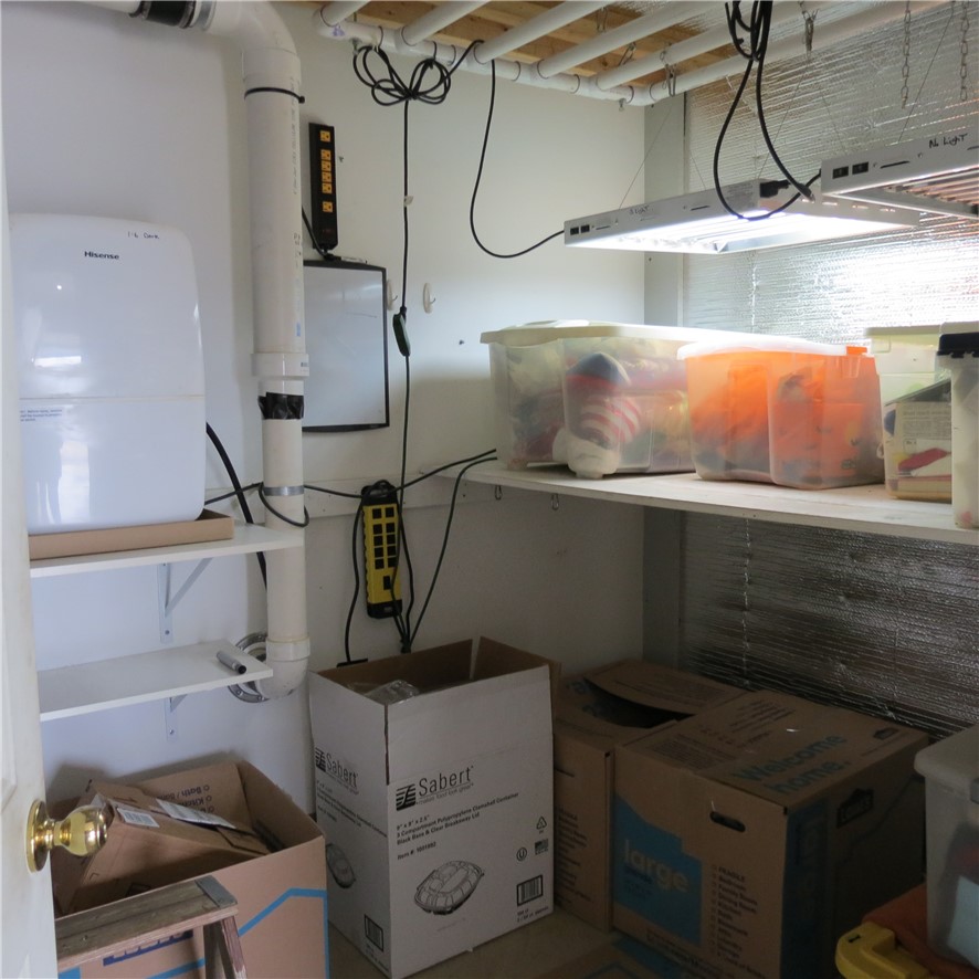 21242 Dingman-Slagle Road Pemberton, OH 45353 - Photo 20 of 33 This organized utility space offers practical storage solutions and efficient equipment.