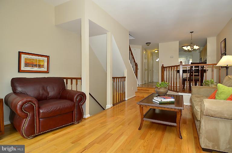1688 Oaktree Court Reston, VA 20194 - Photo 19 of 23 a living room with furniture and wooden floor