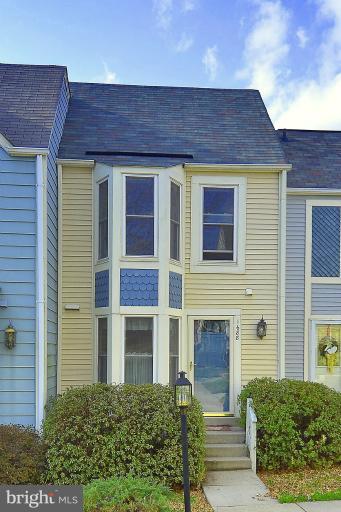 1688 Oaktree Court Reston, VA 20194 - Photo 23 of 23 a front view of a house with a garden