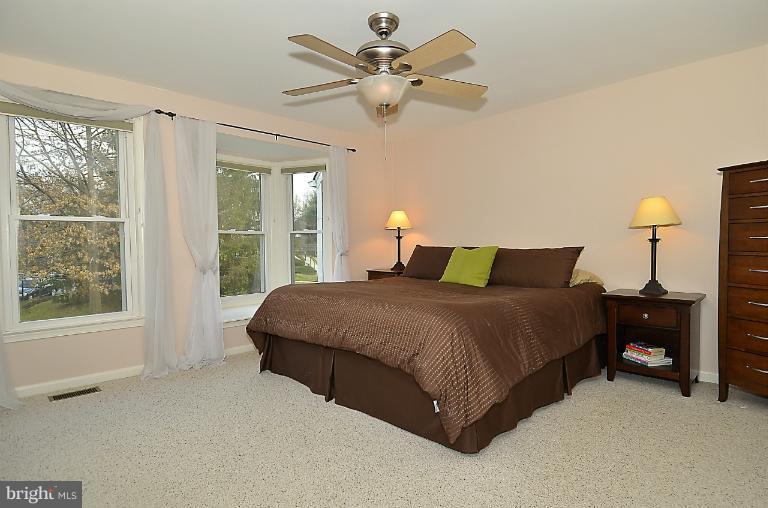 1688 Oaktree Court Reston, VA 20194 - Photo 6 of 23 a bedroom with a bed and window