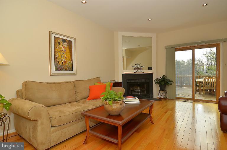 1688 Oaktree Court Reston, VA 20194 - Photo 9 of 23 a living room with furniture and a fireplace