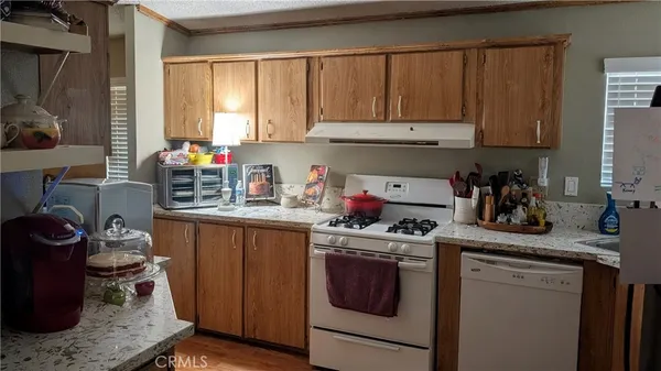 a kitchen with a refrigerator stove and sink