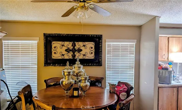 a living room with furniture and a mirror