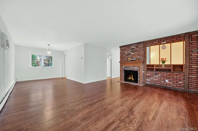 a living room with furniture flat screen tv and a fireplace