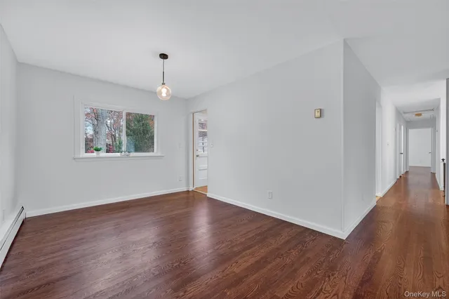 a kitchen with stainless steel appliances granite countertop a sink a stove a dining table and chairs