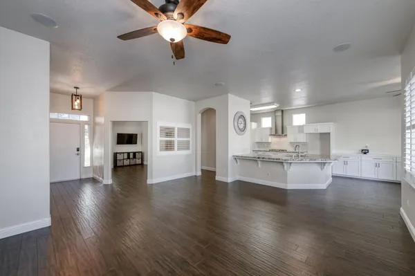 a view of kitchen with sink and wooden floor