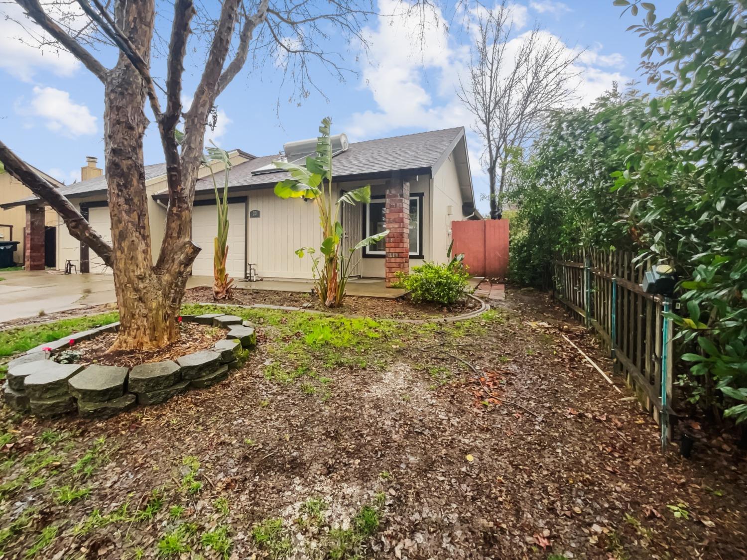 a front view of a house with garden