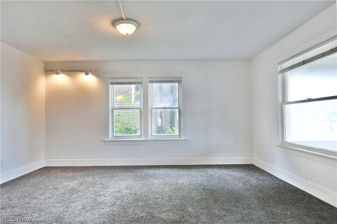 3617 South Main Street Mineral Ridge, OH 44440 - Photo 8 of 34 Unfurnished room featuring a textured ceiling and carpet flooring