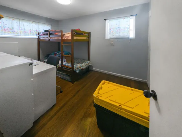 a white toilet sitting next to a bathroom sink and a shower
