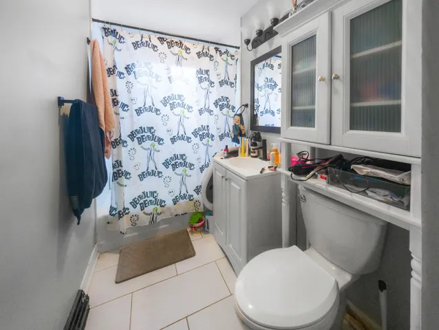 a white toilet sitting next to a bathroom sink