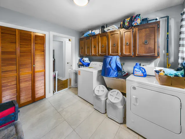 a utility room with dryer and washer